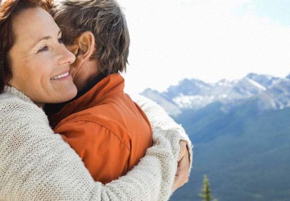 Couple hugging outside