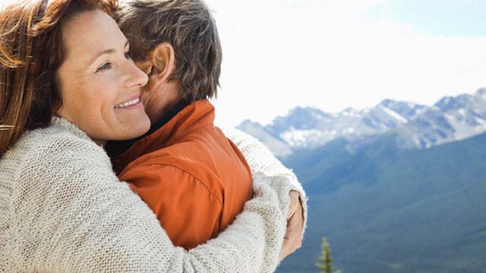 Couple hugging outside