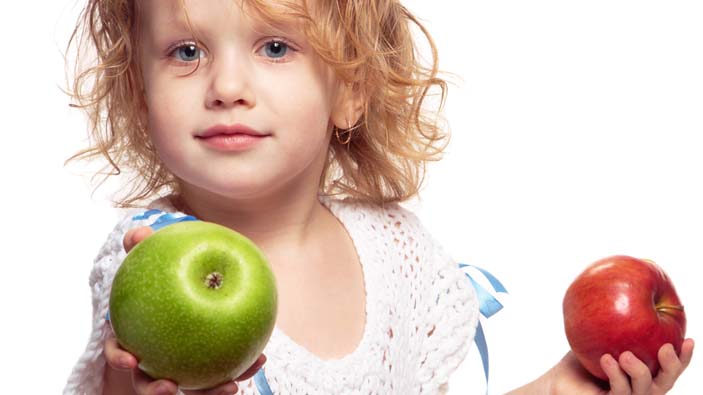 Girl offering to share her apple