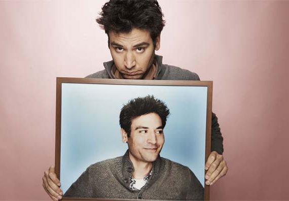 Josh Radnor holding picture of himself.