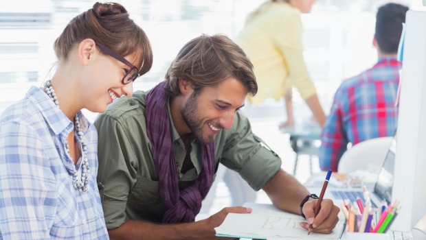 A man and a woman talking at work