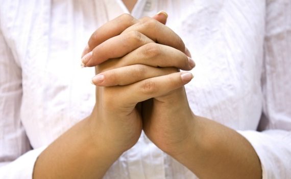 Hands Positioned as in Prayer isolated on white