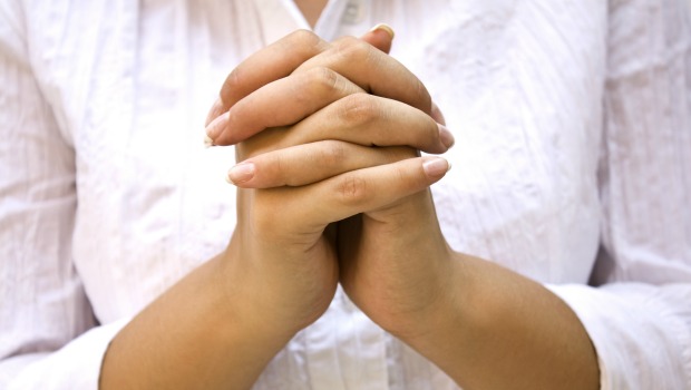 Hands Positioned as in Prayer isolated on white