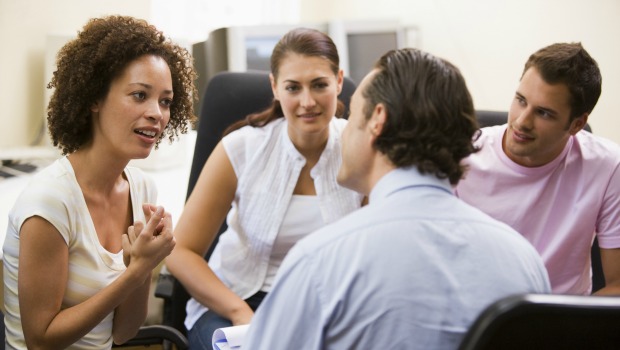 People talking in group at work