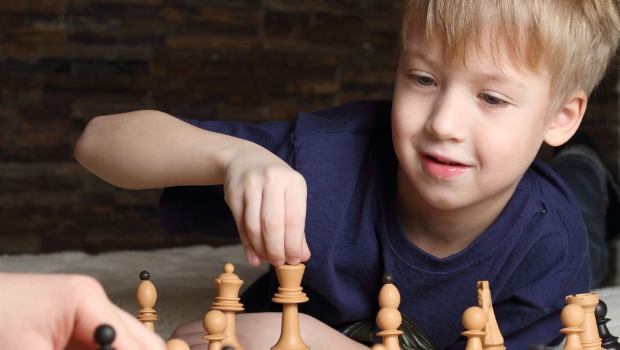 Boy playing chess