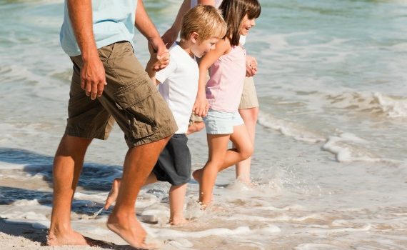 Family walking on the beach