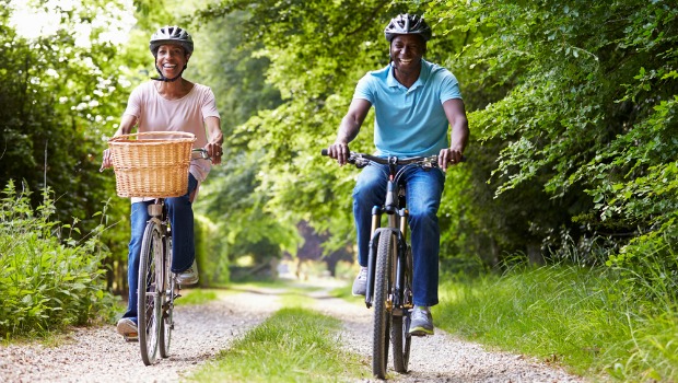 Happy people riding bikes on a path