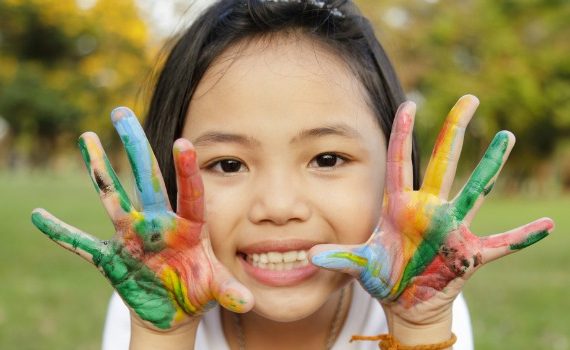 Girl with paint on her hands