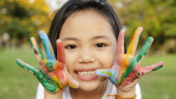 Girl with paint on her hands