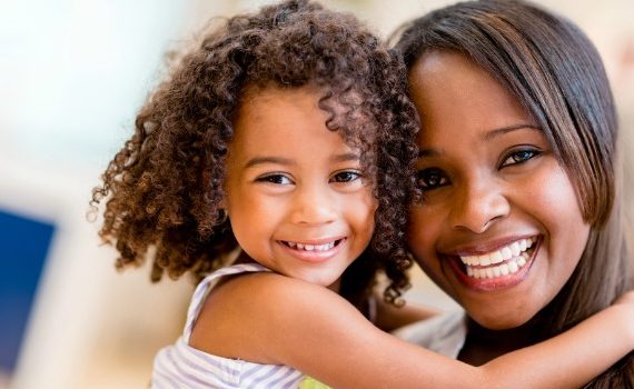 Happy woman and little girl