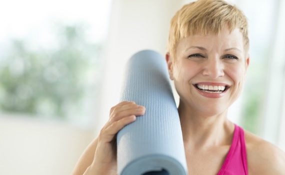 Woman with yoga mat