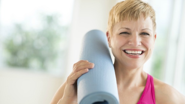 Woman with yoga mat