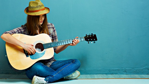 Woman playing guitar
