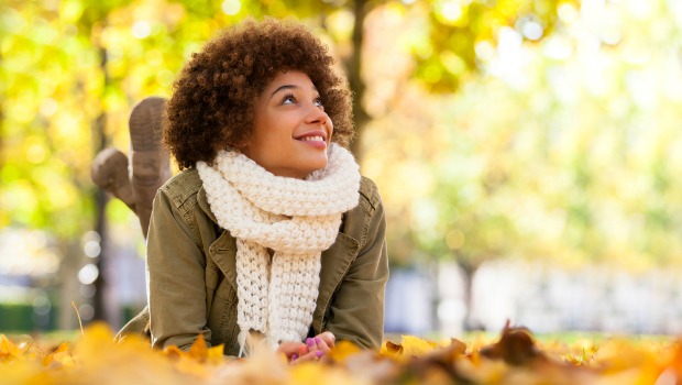 Woman in fallen leaves