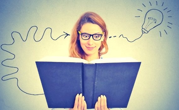 Woman with open book, her head filling with amazing ideas.