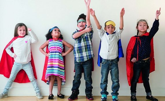 Diverse array of colorfully dressed, happy kids.