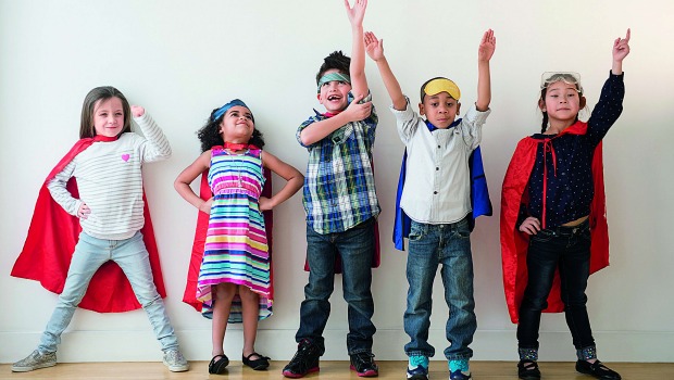 Diverse array of colorfully dressed, happy kids.