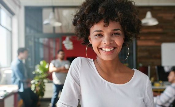 Smiling woman who is happy at work