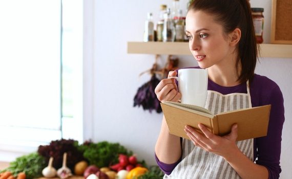 Woman holding a cookbook