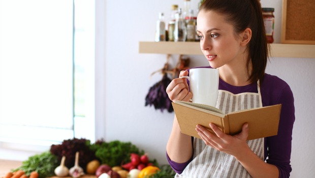 Woman holding a cookbook