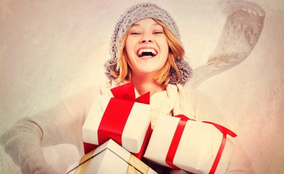 Smiling woman with holiday presents.