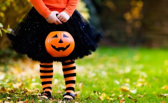 Little girl in Halloween costume.