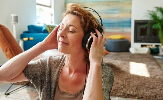 Woman listening to music on her headphones.