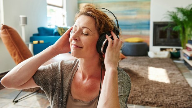 Woman listening to music on her headphones.