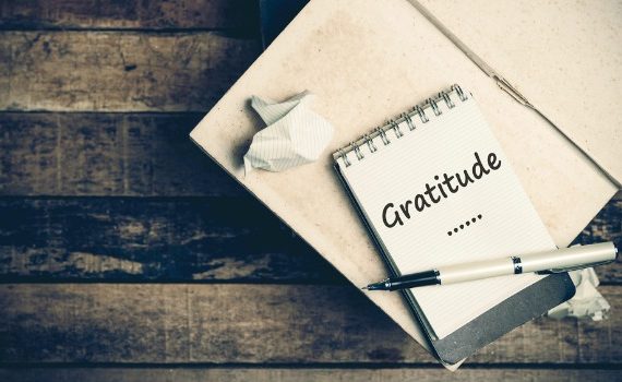 'Gratitude' written on a notepad