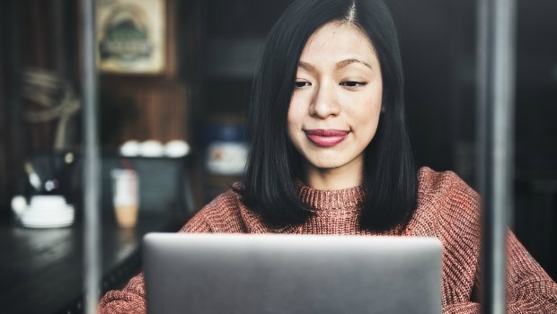 Woman setting goals on her laptop.