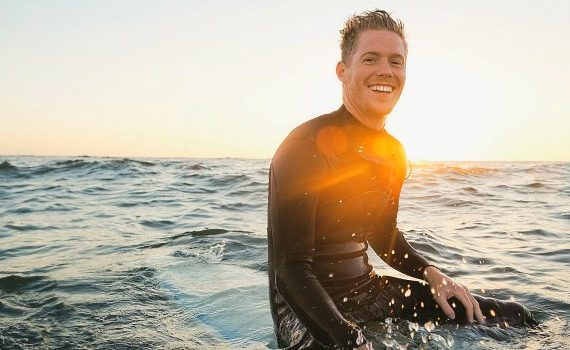 Happy guy on a surfboard