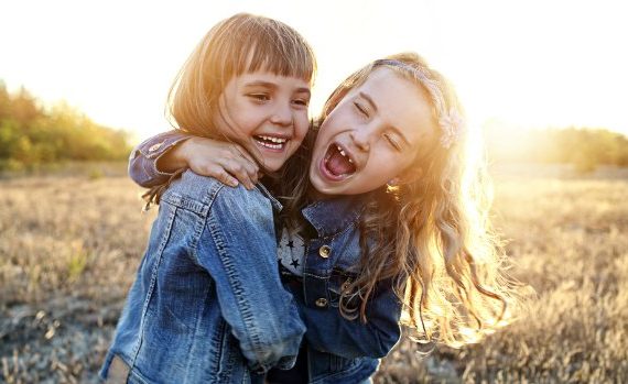 Two girls laughing