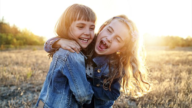 Two girls laughing