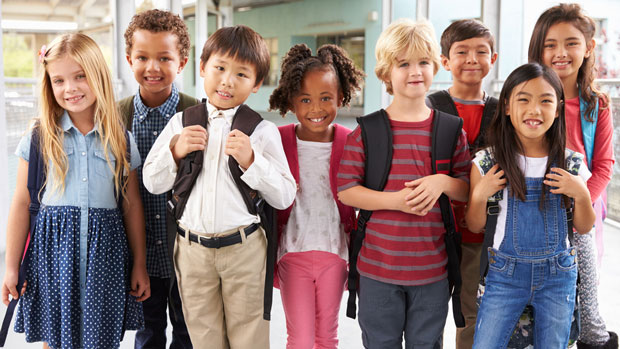 Group of happy elementary school kids.