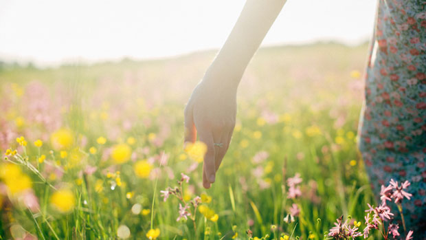 Woman in a field of wildflowers