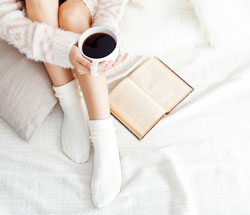 Woman reading in bed