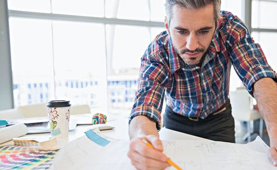 Architect working on a drawing.