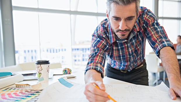 Architect working on a drawing.