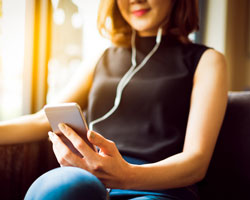 Woman listening to book on tape.