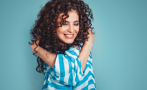 Woman hugging herself