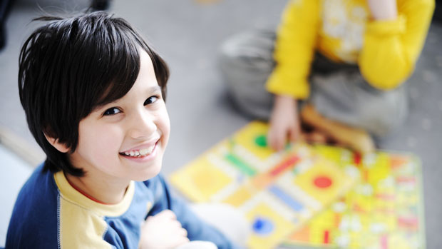 Kids playing a board game.