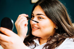 Woman putting on make-up