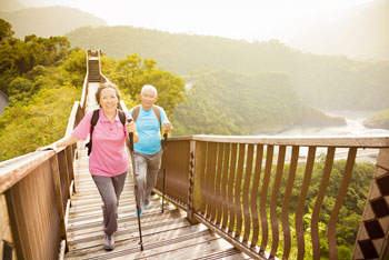 Couple crossing a bridge