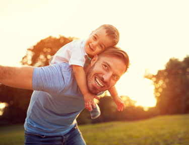 Dad playing with son