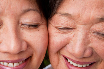 Two happy women face to face.