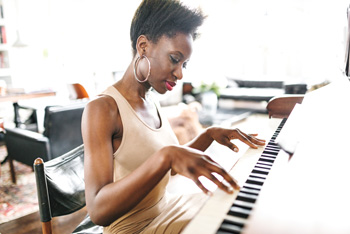 Woman practicing piano