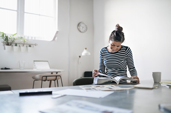 Woman reading in a classroom