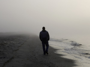 Depressed man on a beach