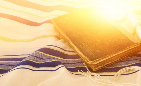 Jewish prayer book and talit.