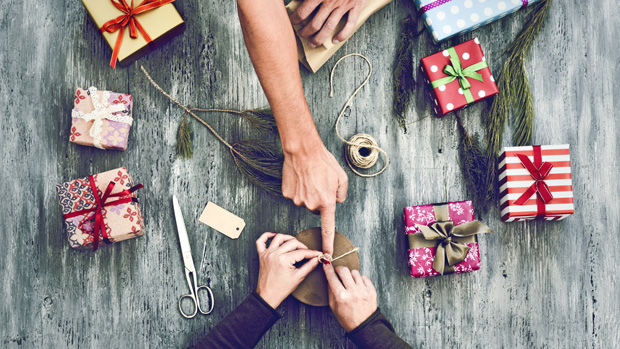 People wrapping holiday gifts